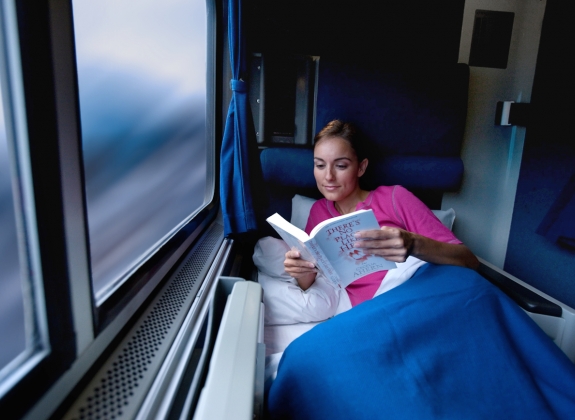 Amtrak Roomette woman reading book in a roomette onboard amtrak